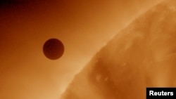 This handout image, courtesy of NASA, shows the planet Venus at the start of its transit of the Sun, June 5, 2012. (REUTERS/NASA/AIA/Solar Dynamics Observatory/Handout)