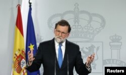 FILE - Spain's Prime Minister Mariano Rajoy attends a press conference at the Moncloa Palace in Madrid, Dec. 22, 2017.