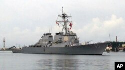 In this Aug. 8, 2016, file photo, the guided missile destroyer USS Benfold arrives for a visit at port in Qingdao, China. (AP Photo/Borg Wong, File)