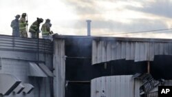 Firefighters work at the scene of a factory fire in New Windsor, N.Y., Nov. 20, 2017.