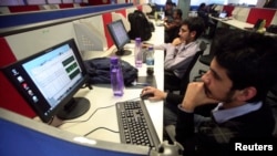 FILE: Employees of Snapdeal.com, an Indian online discount shopping website, work inside their company office in New Delhi, March 1, 2012. 