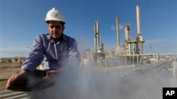 In this February 2011 photo, a man works at an oil refinery in eastern Libya, where support for federalism is growing.