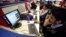 FILE: Employees of Snapdeal.com, an Indian online discount shopping website, work inside their company office in New Delhi, Mar. 1, 2012. 