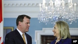 Secretary of State Hillary Rodham Clinton (r) with Canadian Foreign Minister John Baird at the State Department in Washington, Aug. 4, 2011