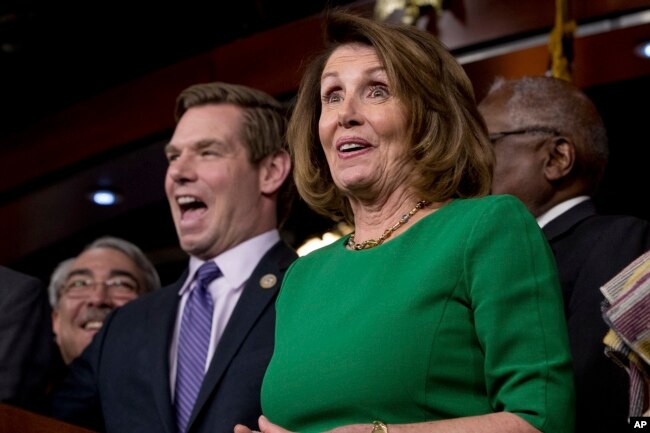 House Minority Leader Nancy Pelosi of Calif. (right) accompanied by Rep. G. K. Butterfield, D-N.C. (left) and Rep. Eric Swalwell, D-Calif. (second from left) as they joke while speaking at a news conference on Capitol Hill in Washington, March 24, 2017.