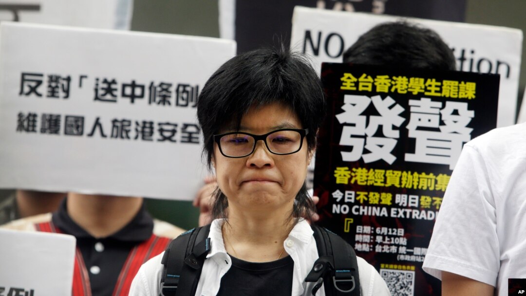 Taiwanese people gather to support Hong Kong people as the administration prepares to open debate on a highly controversial extradition law, in front of Hong Kong Economic, Trade and Culture Office in Taipei, Taiwan, June 12, 2019.