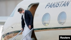 FILE - Pakistan's Prime Minister Imran Khan disembarks from his plane at the airport in Katunayake, Sri Lanka, Feb. 23, 2021, during a visit to the country. 