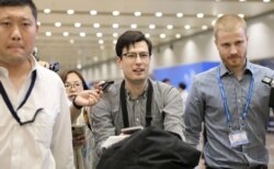 Australian student Alek Sigley, 29, who was detained in North Korea, arrives at Beijing international airport in Beijing, July 4, 2019.