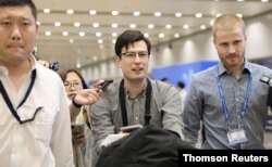 Australian student Alek Sigley, 29, who was detained in North Korea, arrives at Beijing international airport in Beijing, July 4, 2019.
