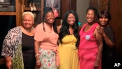 In this photo provided by Steve Morgan, Mary Louise Brown Morgan, second from right, poses with relatives in the fall of 2019. 