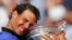Spain's Rafael Nadal holds the trophy as he celebrates winning his tenth French Open title against Switzerland's Stan Wawrinka, during their men's final match of the French Open tennis tournament at Roland Garros stadium, in Paris, June 11, 2017.