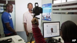A Haitian has his photo taken at the Interior Ministry as he registers for legal residency in Santo Domingo, Dominican Republic, June 16, 2015. 