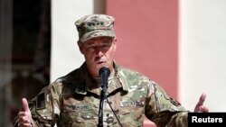 Incoming Commander of Resolute Support forces and command of NATO forces in Afghanistan, U.S. Army General Scott Miller speaks during a change of command ceremony in Resolute Support headquarters in Kabul, Afghanistan, Sept. 2, 2018.