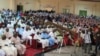 Large crowd listens intently during Town Hall meeting on Girls' Education in Sokoto, Nigeria