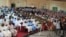 Large crowd listens intently during Town Hall meeting on Girls' Education in Sokoto, Nigeria