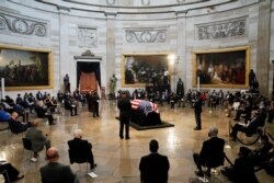 The flag-draped casket of the late Rep. John Lewis, D-Ga., a key figure in the civil rights movement and a 17-term congressman, lies in state at the Capitol in Washington, D.C., July 27, 2020.