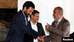 Fabrizio Carboni, Regional Director for the Near and Middle East of the ICRC, Abdulkader al-Murtada, head of the Houthi prisoner exchange committee and Hadi Haig, head of the Yemeni government delegation, in Glion, Switzerland, Sept. 27, 2020.