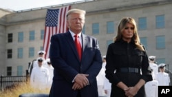 President Donald Trump and first lady Melania Trump participate in a moment of silence honoring the victims of the Sept. 11 terrorist attacks, Sept. 11, 2019, at the Pentagon. 