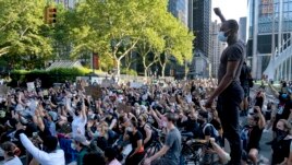 A group of protesters take a knee while marching in lower Manhattan, Saturday, June 6, 2020, in New York. Protests continued following the death of George Floyd, who died after being restrained by Minneapolis police officers on May 25. (AP Photo/Craig Ruttle)
