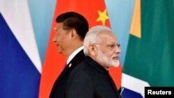 Le président chinois Xi Jinping et le premier ministre indien Narendra Modi
