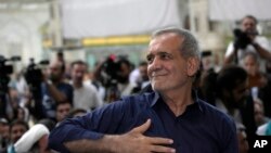 FILE - Iranian President-elect Masoud Pezeshkian greets supporters a day after the presidential election, at the shrine of the late revolutionary founder Ayatollah Khomeini, just outside Tehran, Iran, July 6, 2024.