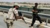 Tentara dari pasukan keamanan Irak dan milisia Syiah berpatroli di Amerli, sekitar 170 kilometer utara Baghdad (31/8).
