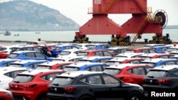 Sports utility vehicles (SUVs) waiting to be exported are seen at a port in Lianyungang, Jiangsu province, China, April 5, 2018. 