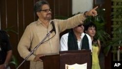 FILE - Ivan Marquez, chief negotiator for the Revolutionary Armed Forces of Colombia (FARC), gestures during a news conference at the close of another round of peace talks with Colombia's governmentin Havana, Cuba, March 27, 2015. 