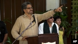 FILE - Ivan Marquez, chief FARC negotiator, sought to downplay pessimistic remarks by government negotiator Humberto de la Calle, saying, "We don't have to give any space to ominous voices about the failure of the talks."