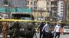 Health workers retrieve a body after an attack that targeted a bus carrying mostly government employees in Kabul, Afghanistan, June 3, 2019.