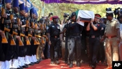 The body of India's National Security Guard commando, Niranjan Kumar, is carried by Indian soldiers as they pay their last respects in Bangalore, India, Jan. 4, 2016. 