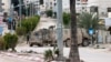 Israeli troops man a position at the entrance of the occupied West Bank refugee camp of Tulkarem, during an ongoing military raid on Feb. 21, 2025. 