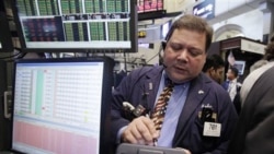 Trader John Santiago works on the floor of the New York Stock Exchange earlier this month.