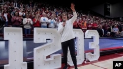 Stanford head coach Tara VanDerveer waves to the crowd after breaking the college basketball record for wins with her team's victory over Oregon State in an NCAA college basketball game, Jan. 21, 2024, in Stanford, Calif. 