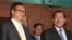 FILE PHOTO - Cambodian Prime Minister Hun Sen, right, talks with the main Opposition Party leader Sam Rainsy, left, of Cambodia National Rescue Party, after their meeting in Senate headquarters in Phnom Penh, Cambodia, Tuesday, July 22, 2012. (AP Photo/Heng Sinith)