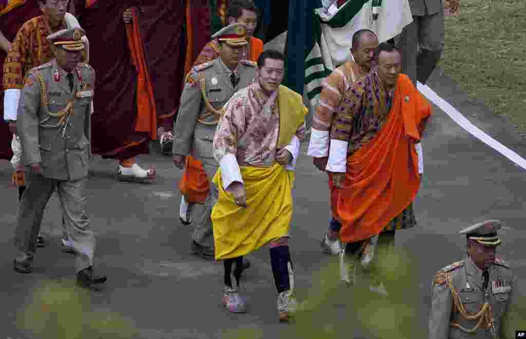 King Jigme Khesar Namgyel Wangchuck walks towards the Punkaha Dzong to take part in his wedding to Jetsun Pema in Bhutan's ancient capital Punakha. (Reuters)