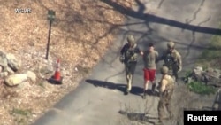 FILE: FBI agents arrest Jack Teixeira of the U.S. Air Force National Guard in connection with an investigation into the leaks online of classified U.S. documents, in North Dighton, Massachusetts, on April 13, 2023. WCVB-TV via ABC via REUTERS.