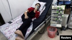 A civilian breathes through an oxygen mask at a hospital after a suspected gas attack in Syria.