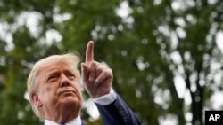 President Donald Trump speaks to members of the press on the South Lawn of the White House in Washington, Sept. 24, 2020.