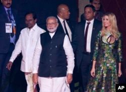 FILE - Indian Prime Minister Narendra Modi, front, U.S. presidential adviser and daughter Ivanka Trump, right, and Telangana state Chief Minister K. Chandrashekara Rao arrive for the opening of the Global Entrepreneurship Summit in Hyderabad, India.