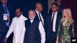 Indian Prime Minister Narendra Modi, front, U.S. presidential adviser and daughter Ivanka Trump, right, and Telangana state Chief Minister K. Chandrashekara Rao arrive for the opening of the Global Entrepreneurship Summit in Hyderabad, India, Tuesday, Nov
