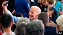 Former Vice President Joe Biden takes photos with supporters following the first rally of his 2020 campaign, May 4, 2019 in Columbia, S.C.