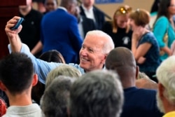 Former Vice President Joe Biden takes photos with supporters following the first rally of his 2020 campaign, May 4, 2019 in Columbia, S.C.