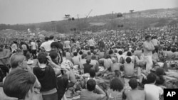 FILE - This is a general view of the crowd at the Woodstock Music and Arts Festival, Aug. 14, 1969. 