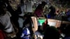 FILE - Sudanese protesters attend a demonstration along the streets of Khartoum, May 22, 2019. 