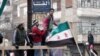 مخالفان اسد با اتوبوس حمص را ترک کردند