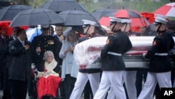 Annie Glenn, seated, widow of John Glenn, watches as members of the U.S. Marine Corps from Marine Barracks Washington carry the casket of her husband during his graveside service at Arlington National Cemetery in Arlington, Virginia, April 6, 2017. (U.S. Army/ Rachel Larue/ Arlington National Cemetery) 