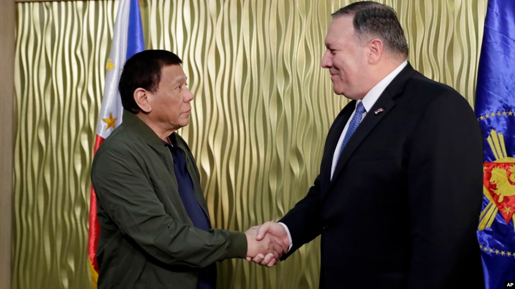 Philippine President Rodrigo Duterte, left, greets U.S. State Secretary Mike Pompeo upon arrival at Villamor Air Base in suburban Pasay city southeast of Manila, Philippines, Thursday, Feb. 28, 2019. 