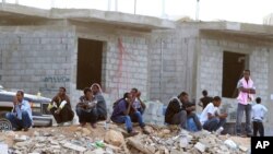 FILE - Ethiopians gather as they wait to be repatriated in Manfouha, southern Riyadh, Nov. 13, 2013. 