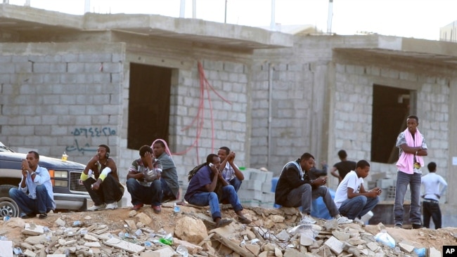 FILE - Ethiopians gather as they wait to be repatriated in Manfouha, southern Riyadh, Nov. 13, 2013. 